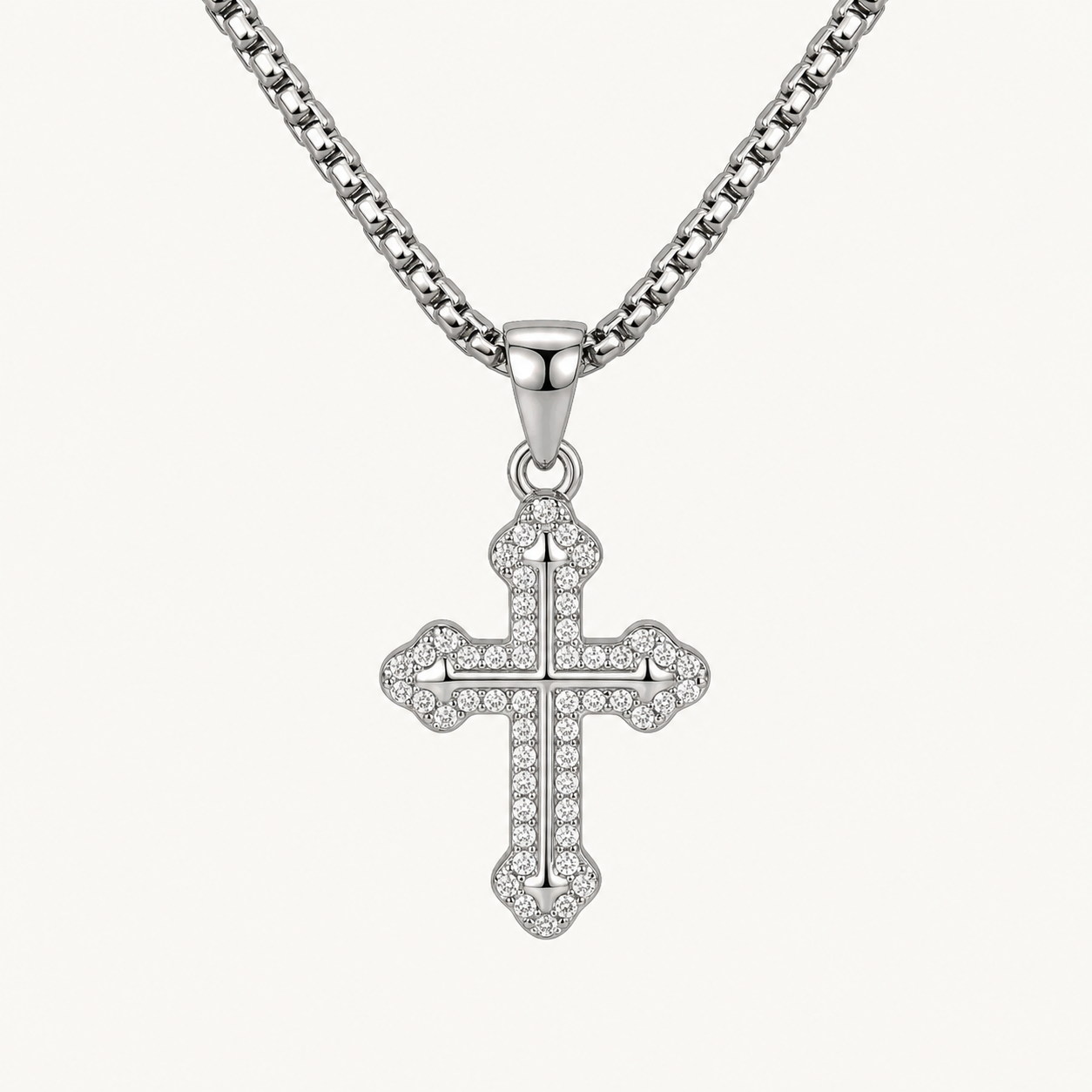 Close-up of titanium pavé cross pendant and 3mm round box chain